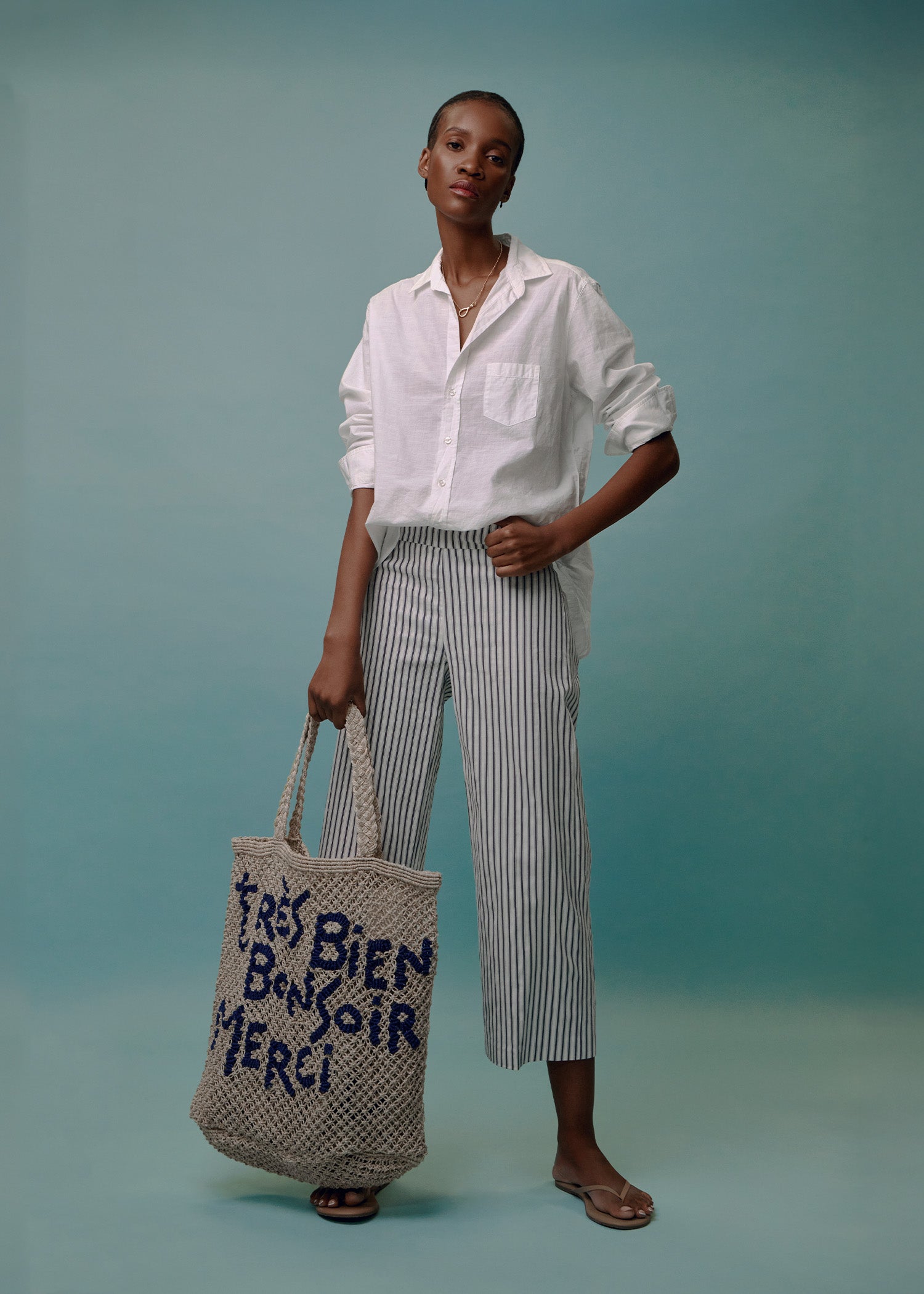 frank and eileen linen shirt and avenue montaigne pants accessorized with a jute bag from the jacksons london and tkees flip flops 