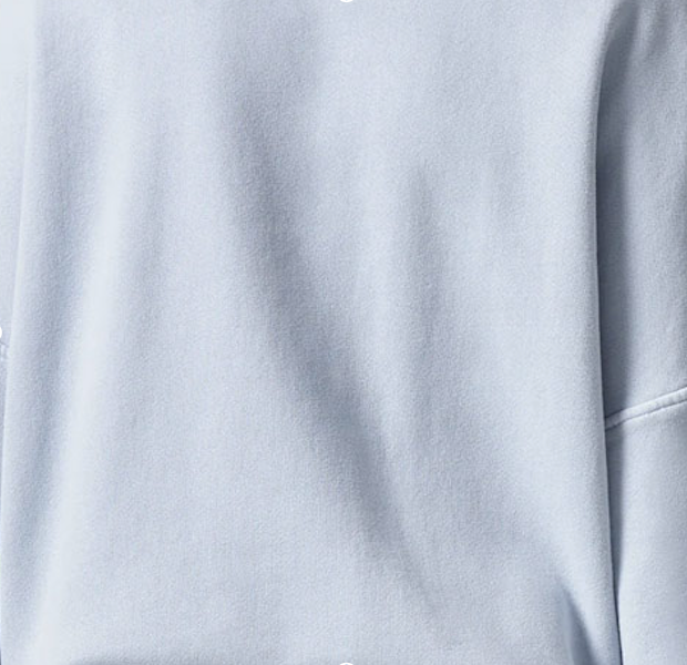 Close-up view of sky-blue fleece fabric, showcasing its soft texture and cozy appearance. 